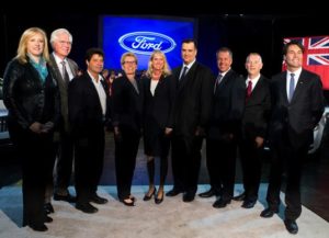 left to right: Lisa Raitt, Minister of Transportation;  Terence Young, Oakville Tory MP; Jerry Dias, National President of Unifor; Ontario premier Kathleen Wynne; Dianne Craig, president and CEO, Ford of Canada; James Moore, Minister of Industry; Joe Hinrichs, Executive VP and Ford president of The Americas; Will Cowell, plant manager; and Eric Hoskins, Provincial Minister of Economic Development
