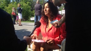 Lynda Kitchikeesic speaking with reporters outside her home. 