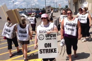 After years of wage concessions, workers at Canada’s largest grocery chain voted down a first deal, forcing their employer back to the table to do better. Members walked a picket line outside a Loblaws store in Chatham, Ontario. Photo: Derry McKeever.