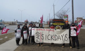 Fight for $15 and Fairness activists on the CHS picket line in Kingston, Ontario