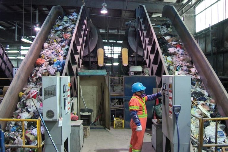 A workers at a garbage processing plant